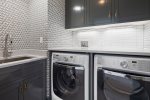 Laundry room with a washer, dryer, and sink for your convenience 